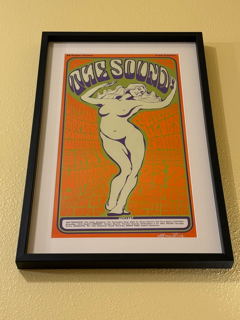 Framed poster of a stylized illustration with text on a beige wall. the Sound rock and roll poster vintage poster concert poster