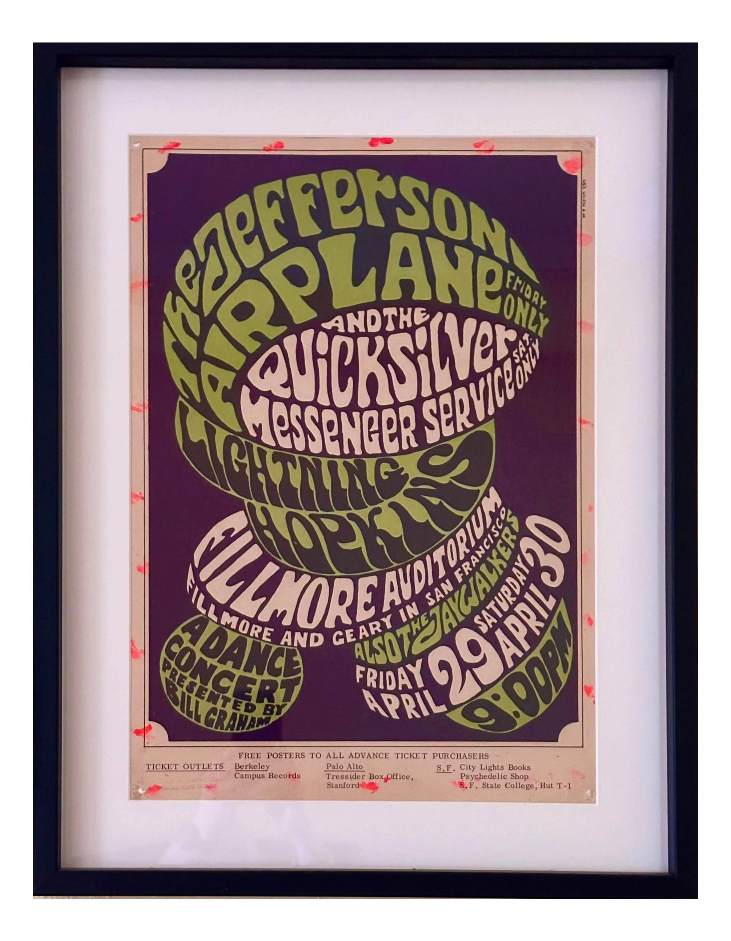 A framed vintage concert poster for Jefferson Airplane, featuring stylized green and cream typography on a dark purple background, mounted in a white mat and a black frame.