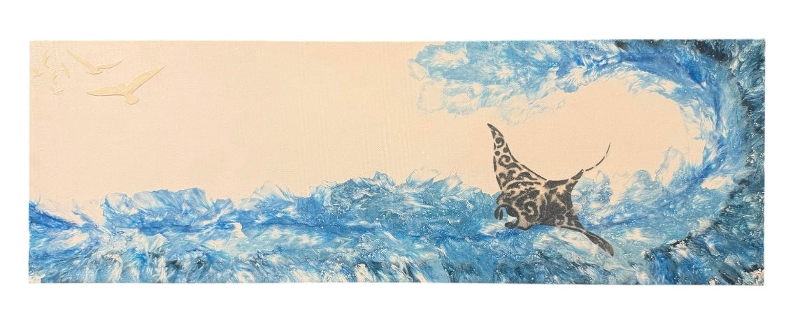 A horizontal art print depicting a manta ray swimming in a swirling blue ocean wave, with a pale beige sky and a small bird in the upper left.