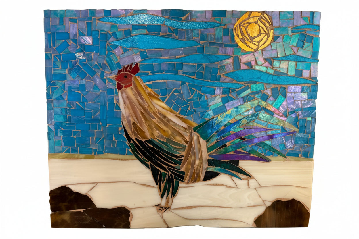 A square mosaic art piece depicting a rooster in profile against a blue tiled background with a yellow sun and white ground, photographed against a plain white backdrop.